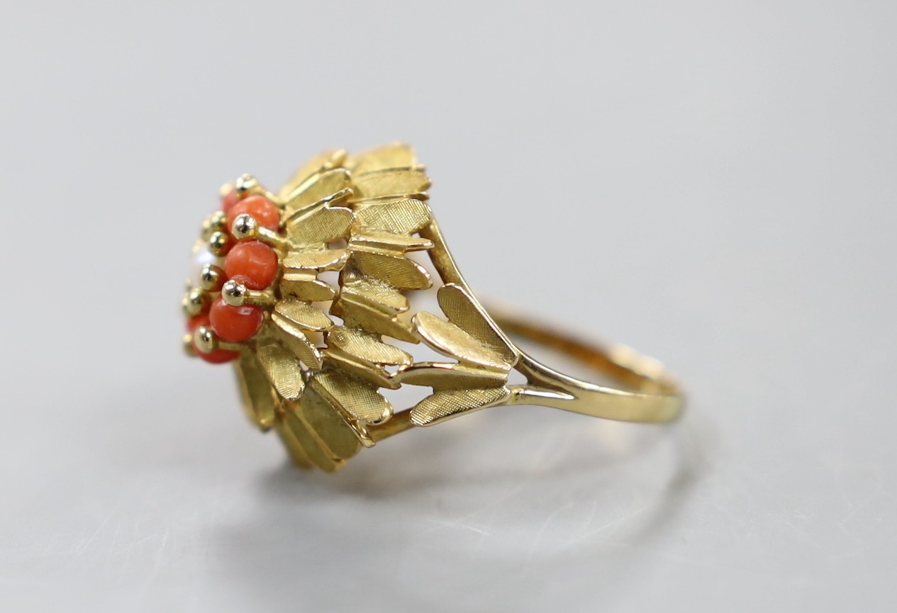 A continental yellow metal, coral bead and culture pearl cluster set dress ring, size R, gross weight 7 grams.
